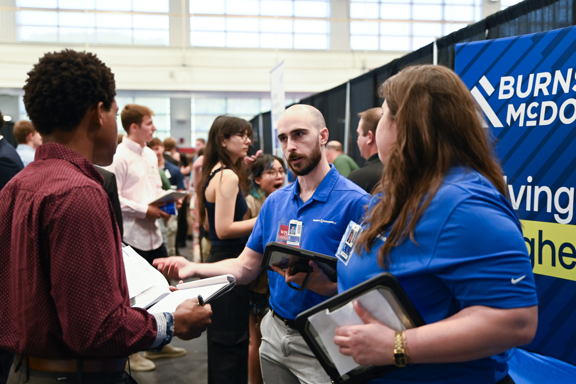 Employers talking to students at the career fair.