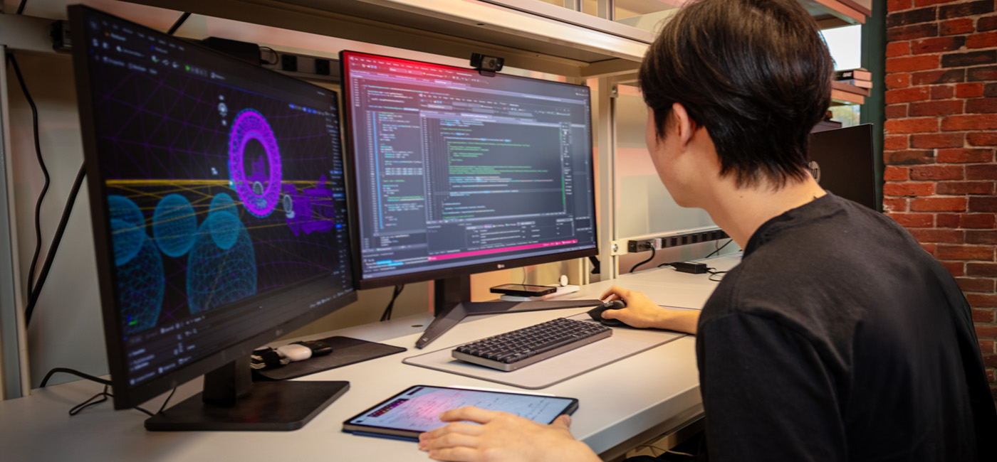 WPI computer science student on computer