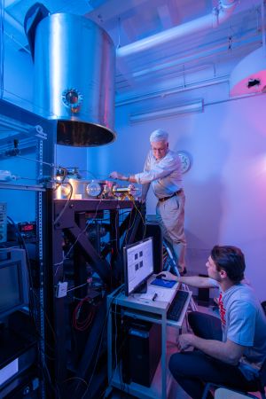 Student and professor looking at equipment in a laboratory
