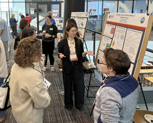 RET Teachers presenting to attendees their poster inspired by their summer research at WPI