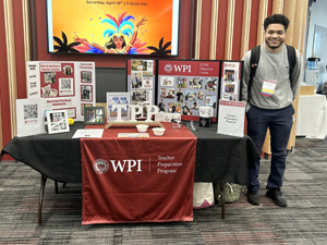 Teacher Prep Student Stands next to the Teacher Prep Table