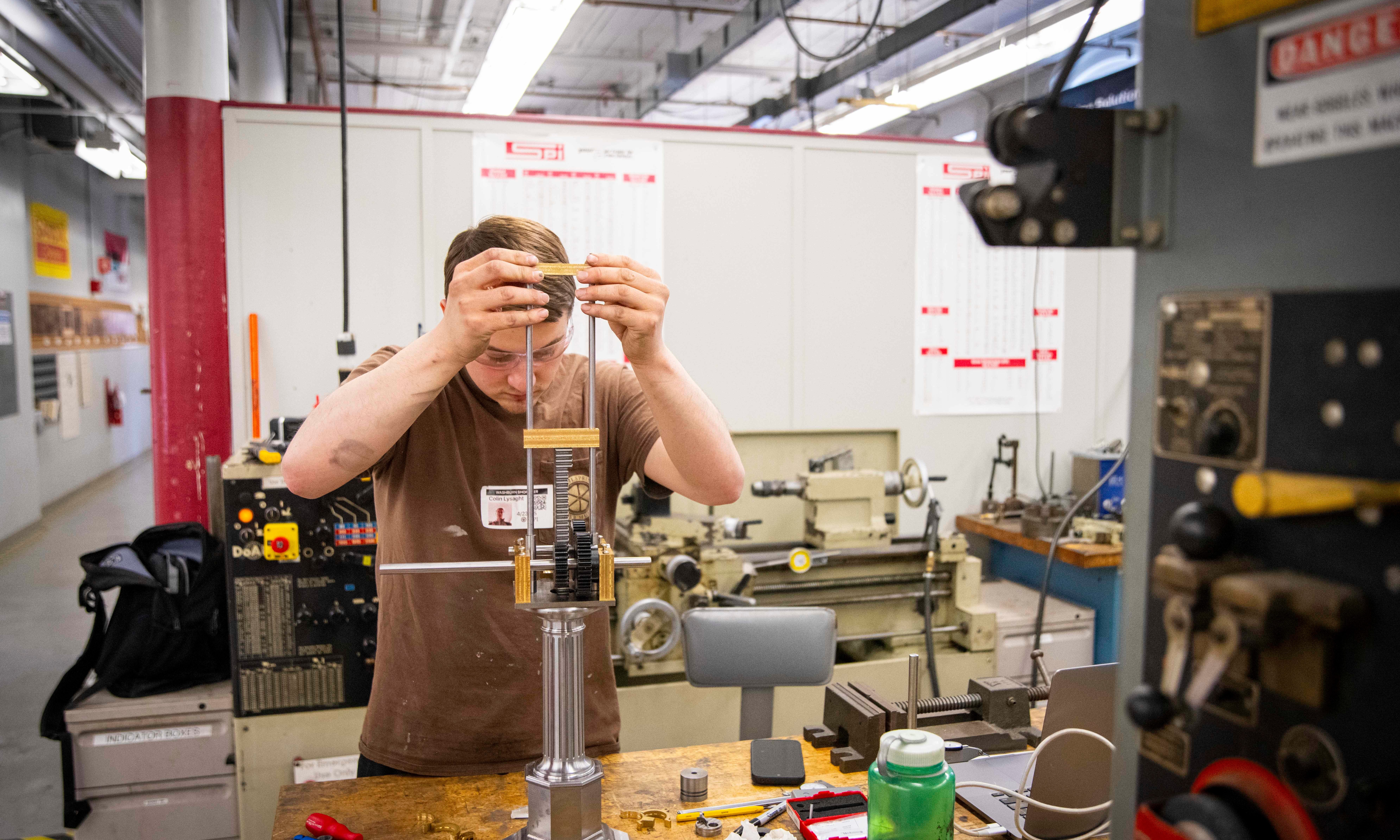 manufacturing engineering student at wpi making machine parts