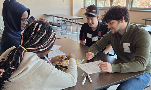 WPI Teacher Prep students working with students on STEM Activity