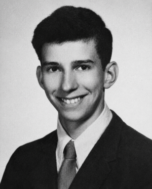 Man in suit smiling in portrait