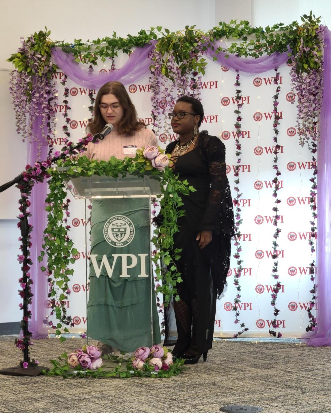 Lily Navarro and Max Ketter, Alliance and QTPOCC Executive Board Members, speaking at Lavender Celebration 2026