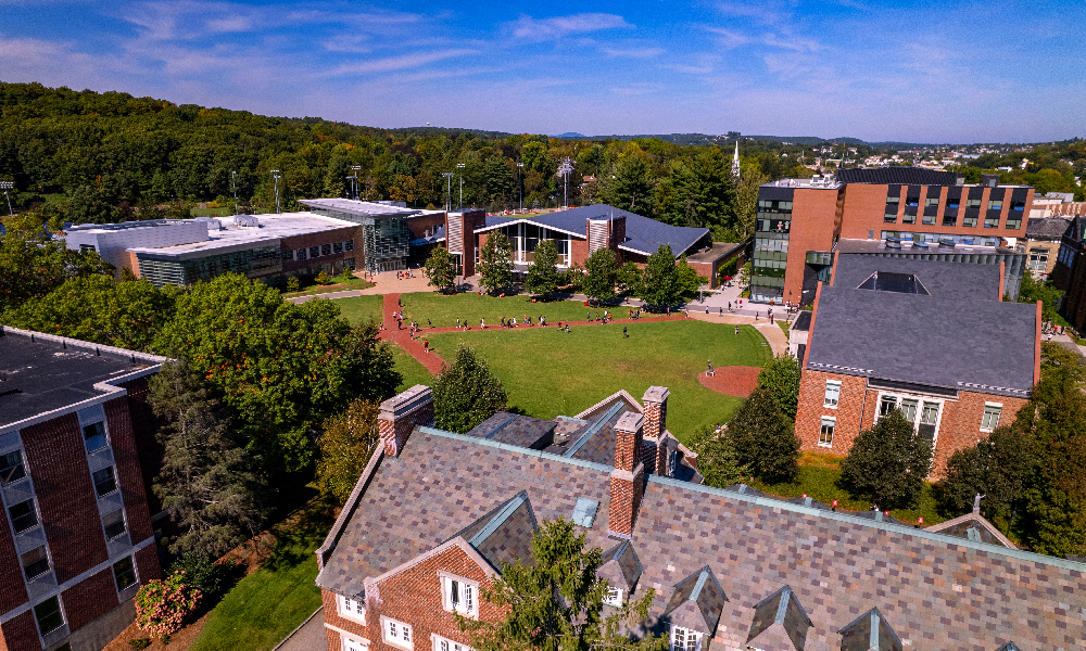 WPI Campus aerial view with campus buildings and green lawns and forests