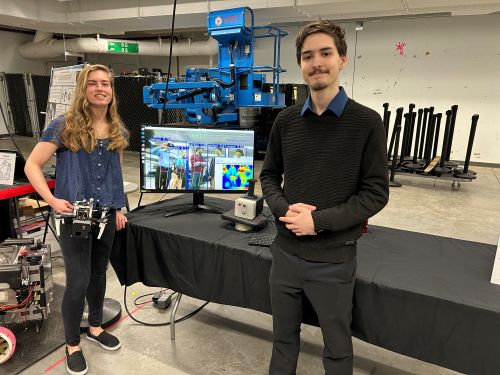 students in front of device