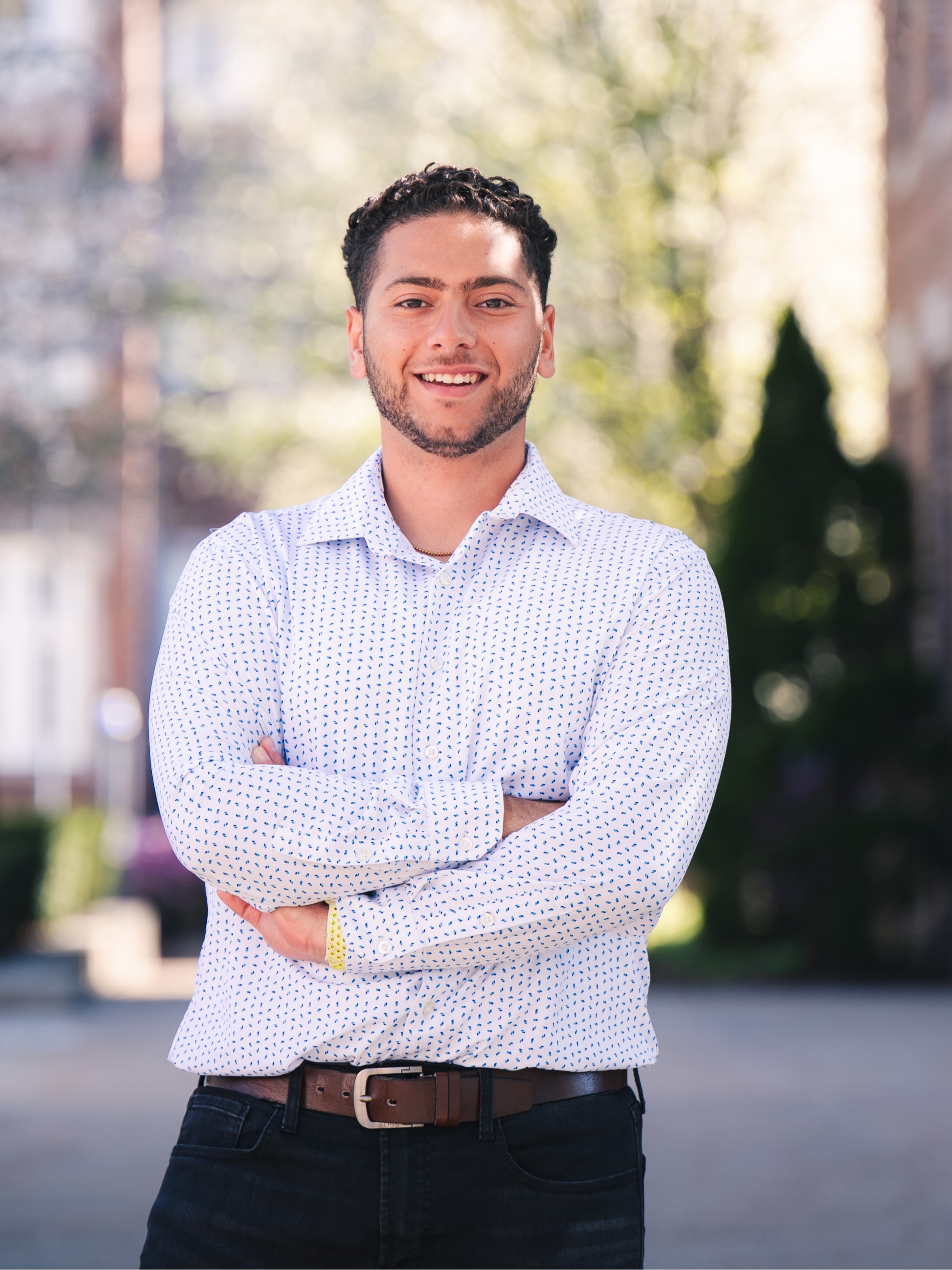 man in white shirt standing outside