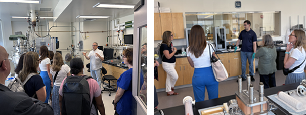 Participants in a biotechnology lab listen to a presenter explaining equipment, with stainless steel instruments and lab components displayed during a guided tour.