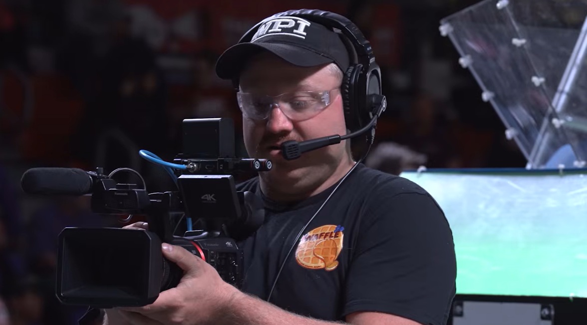 Nick Greeley holding video camera at WAFFLE 