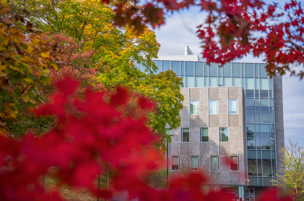 View of Unity Hall through fall foliage