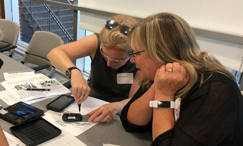 Two WPI MISE Students working together on a project