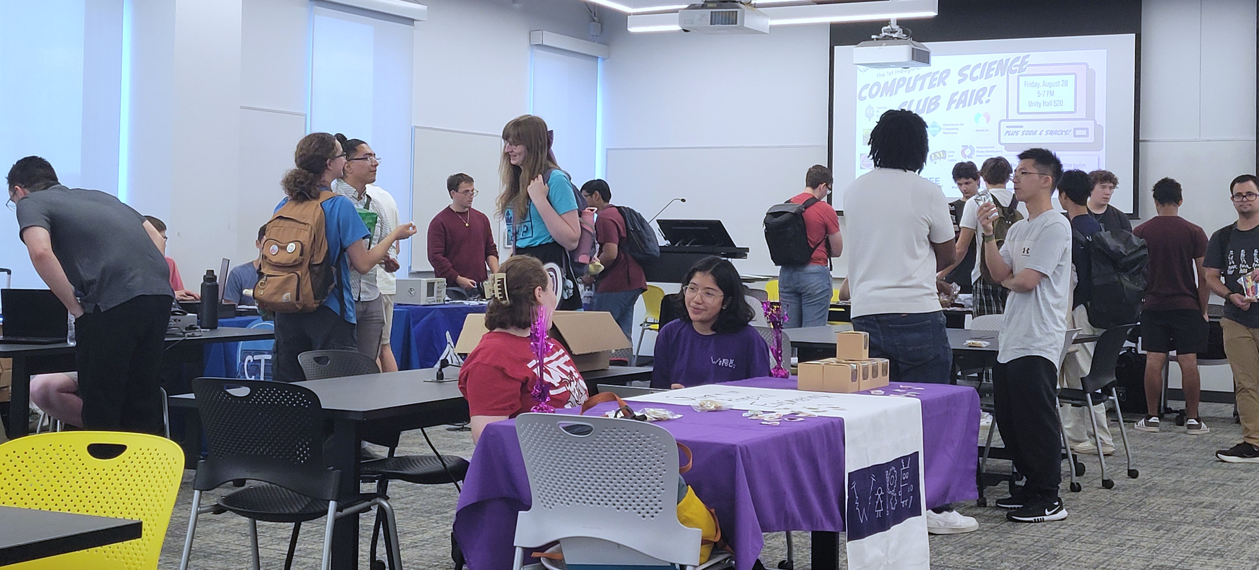 Students visit clubs tabling at the CS Club Fair