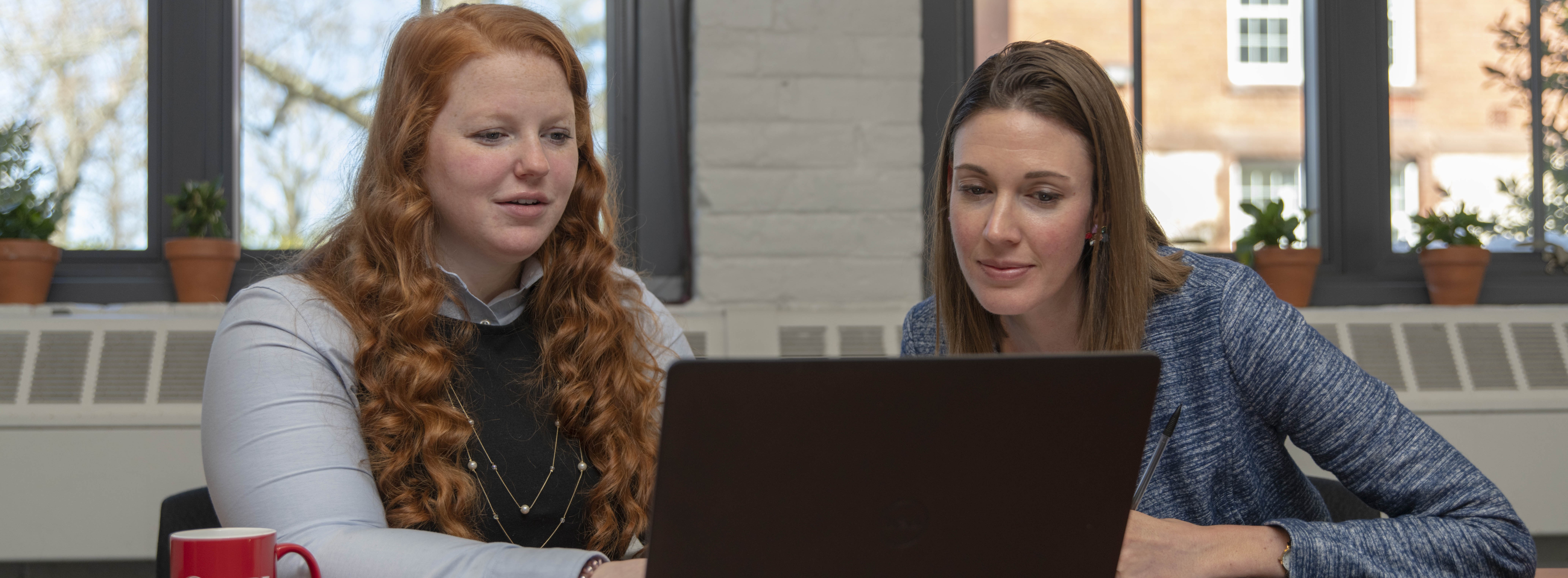 two women at a computer