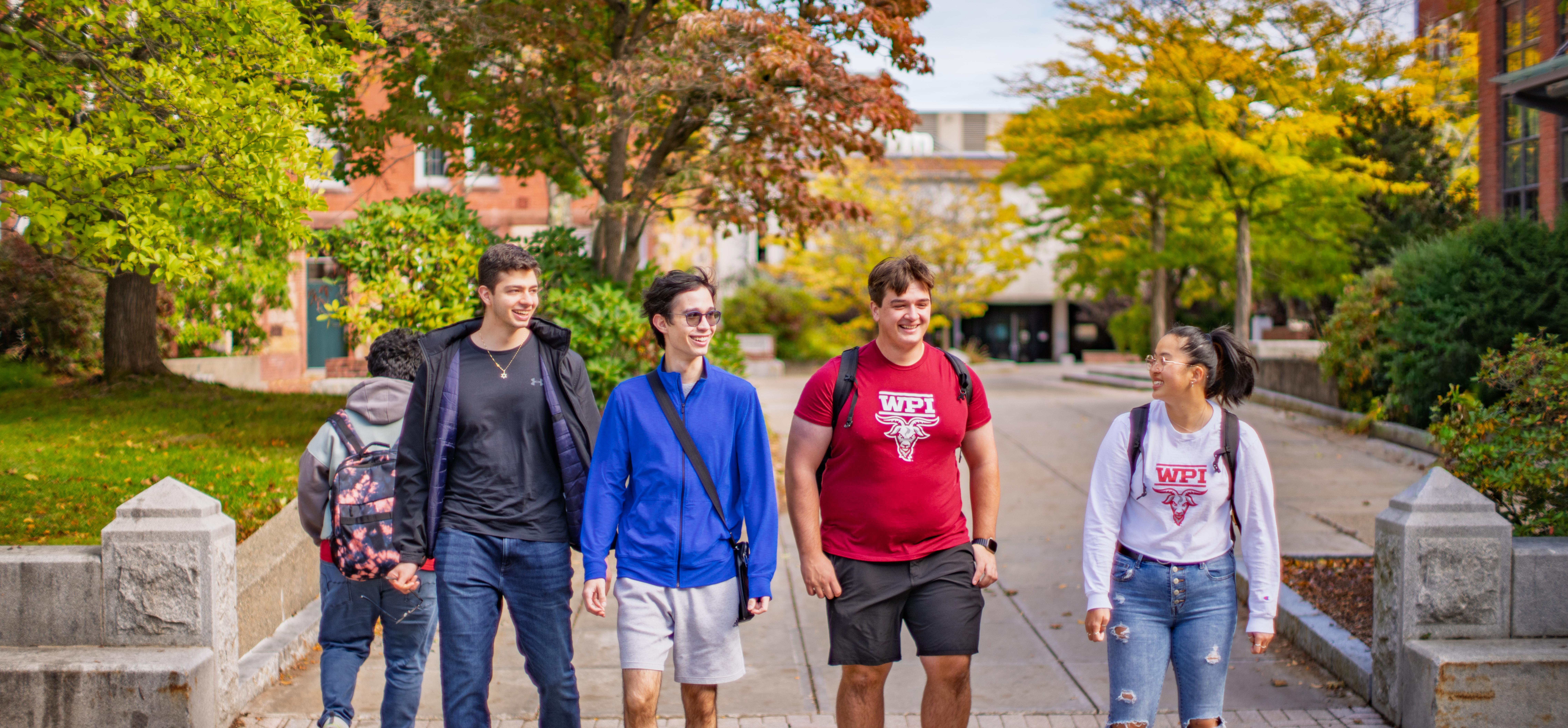 students walking through WPI campus