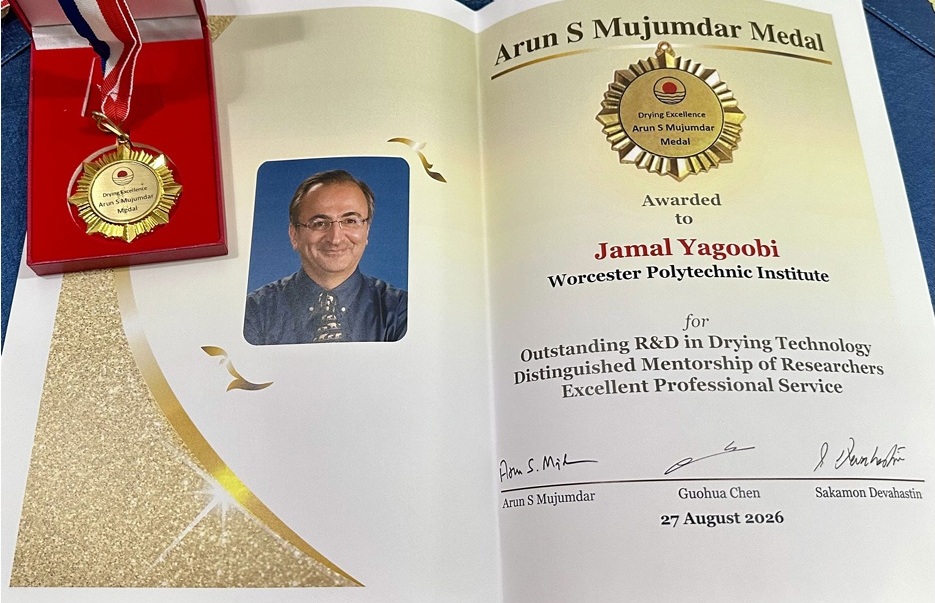 Yagoobi headshot photo with award certificate