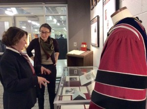 Kathy Markees, special collections curator, and co-curator Molly Bruce, look over an exhibit.