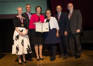 Gladys Rodriguez, center, representing Congressman James McGovern, presented President Leshin and the four individual Gordon Prize recipients a proclamation that was read into the Congressional Record.