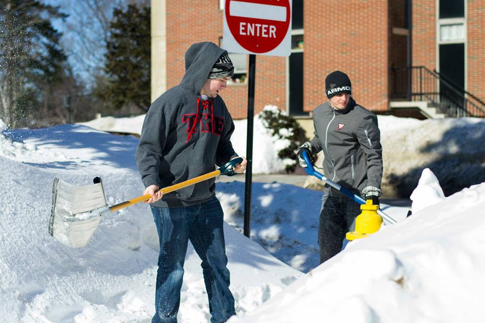 Alex Bell and Steve Como shoveled out two hydrants while WBZ reporter Ken McLeod interviewed the pair.