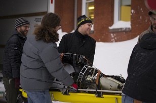 The team carried WARNER’s humanoid form into the lab on a stretcher.