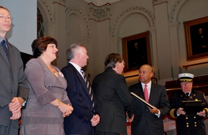 From left, John Orr, Kathy Notarianni, James Duckworth and David Cyganski accept the Fire Marshal's Award from Governor Patrick.
