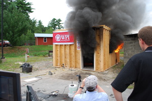 WPI researchers monitor a test of a new flashover detector.