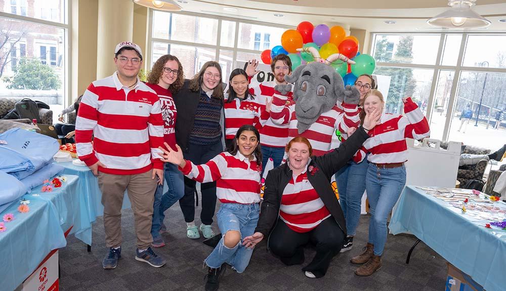 Members of SAS pose with Gompei in the Campus Center during his birthday celebration.