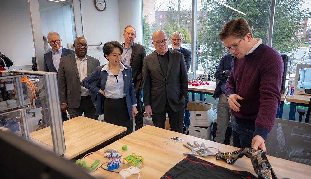 Grace Wang attends a robotics demonstration in Unity Hall with Jim McGovern.