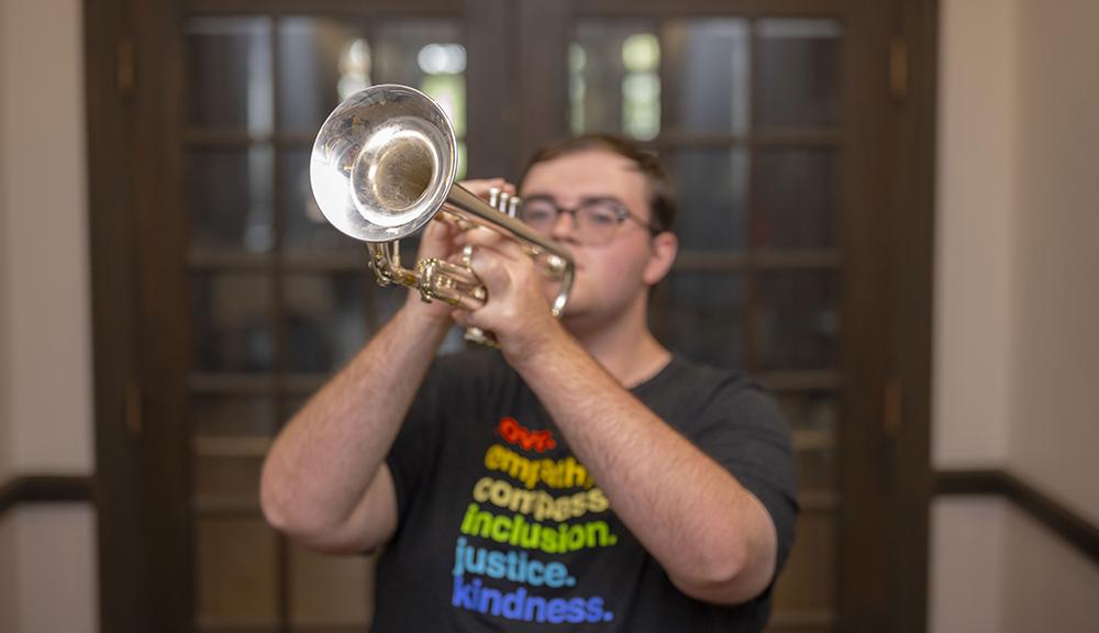 Nick plays the trumpet