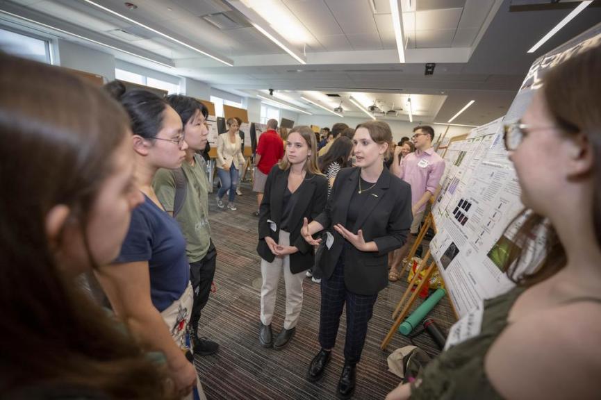 Students discuss their research findings during showcase event on campus