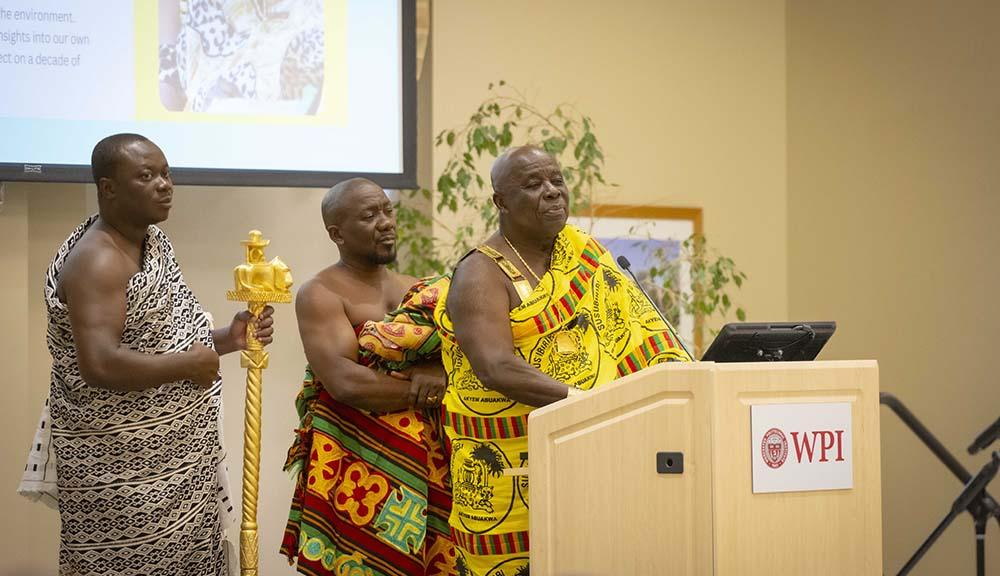 King Okyyenhene of Akyem Abuakwa Ghana addresses the WPI community from a podium in the Odeum.
