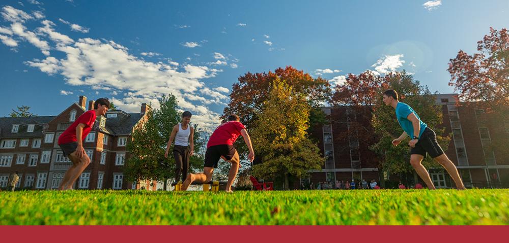 Athletes playing Lawn games outside on the Quad on a sunny day