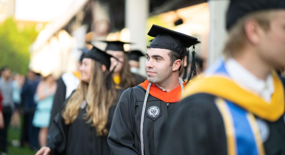 Graduating student walking in a line