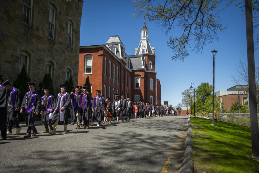 WPI Class of 2024 processional in front of the Washburn Shops on the way to Earle Bridge 