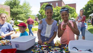 Two young girls play with LEGOs during TouchTomorrow.