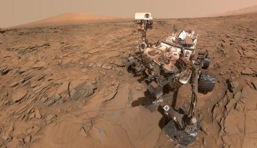 An illustration of the Curiosity rover on the surface of Mars.