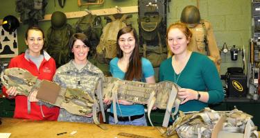 WPI students (from left) Amy Babeu ’14, Army ROTC Cadet Marlisa Overton ’14, Erin LaRoche ’14, and Rachael Matty ’14 display a female-friendly hip belt they helped develop for the Army’s Modular Lightweight Load-carrying Equipment (MOLLE) rucksack.