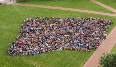 The Class of 2022 sits together on the Quad as an aerial photo is taken.