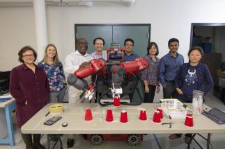 WPI researchers (from left) Soussan Djamasbi, Jeanine Skorinko, Winston Soboyejo, Cagdas Onal (principal investigator), Yunus Telliel, Jing Xiao, Pratap Rao and Jane Li with the Baxter research robot.