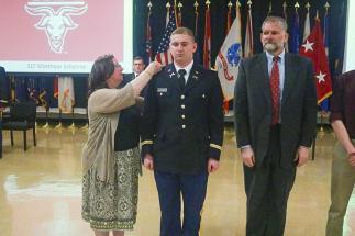 Army 2nd Lt. Matthew Sherrer of Wellesley has his gold bars pinned on by his parents, Janet and Stephen Sherrer.