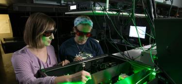 Two WPI Women working in the Lazer Lab