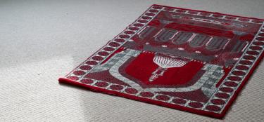 A picture of an islamic mat for prayer