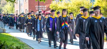 2022 Grads walking in a line for commencement