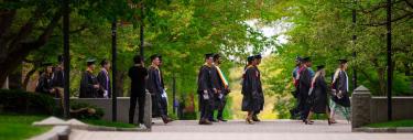 Graduating students walking on campus