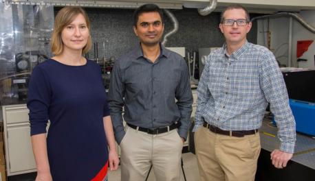 From left, From left, Lyubov Titova, Pratap Rao, and Aaron Deskins, stand in the WPI NanoEnergy Lab looking toward the viewer