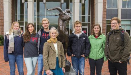 Ulrike Brisson and six exchange students in front of the Gompei statue at the Quad.