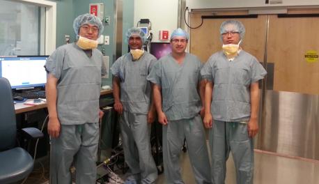 Gregory Fischer, second from right, with PhD candidates, from left, Weijian Shang, Nirav Patel, and Gang Li, at Brigham and Woman’s Hospital, where a surgical robotic system he developed for prostate biopsies was involved in a clinical trial