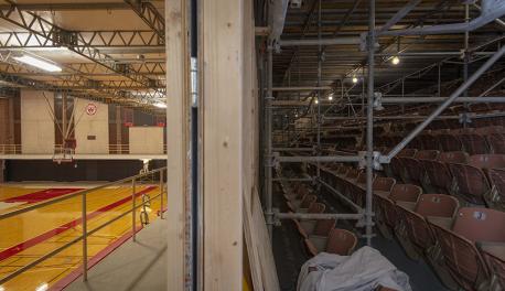 Harrington Auditorium work with scaffolding set up on the right and basketball court on the left.