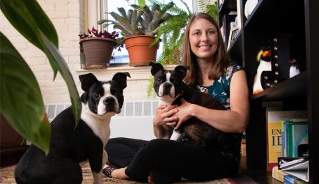 Professor Skorinko sitting in her office with her dogs