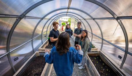 students inside greenhouse